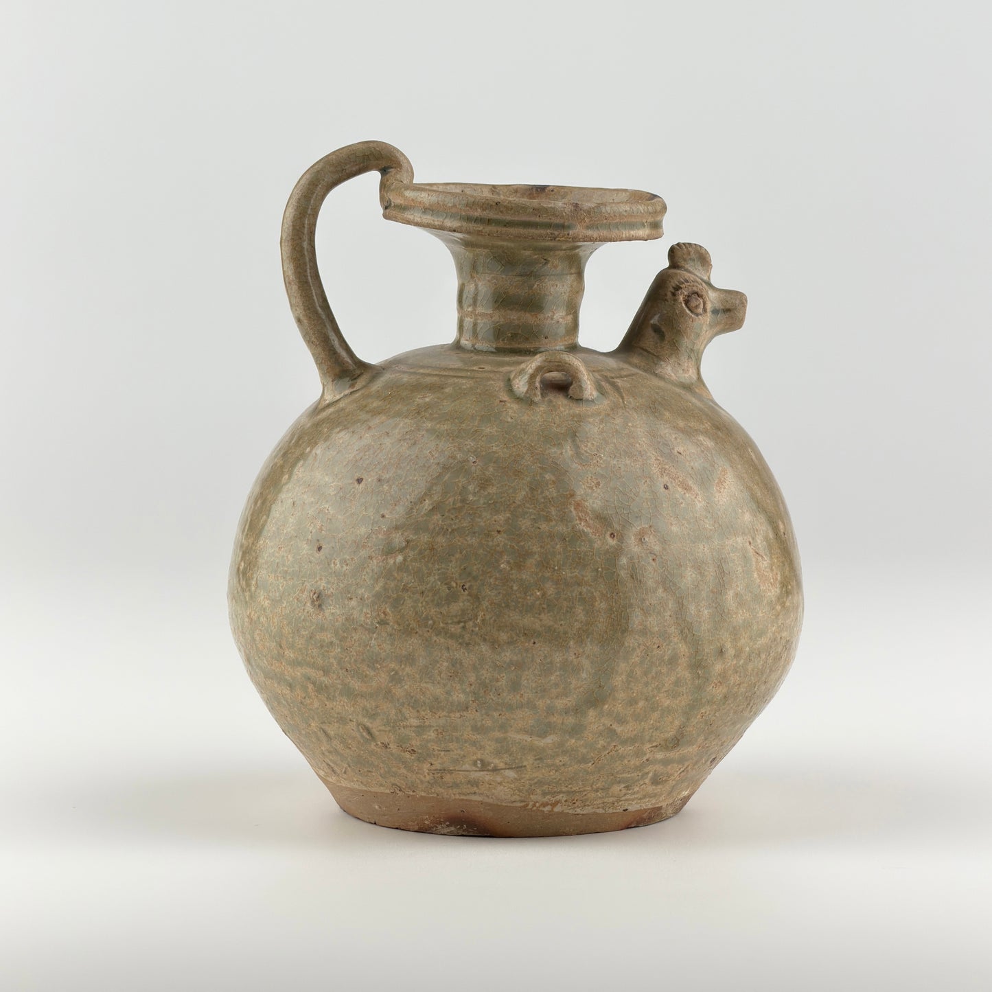 A RARE YUE CELADON CHICKEN-HEAD EWER, JIN-SOUTHERN DYNASTY