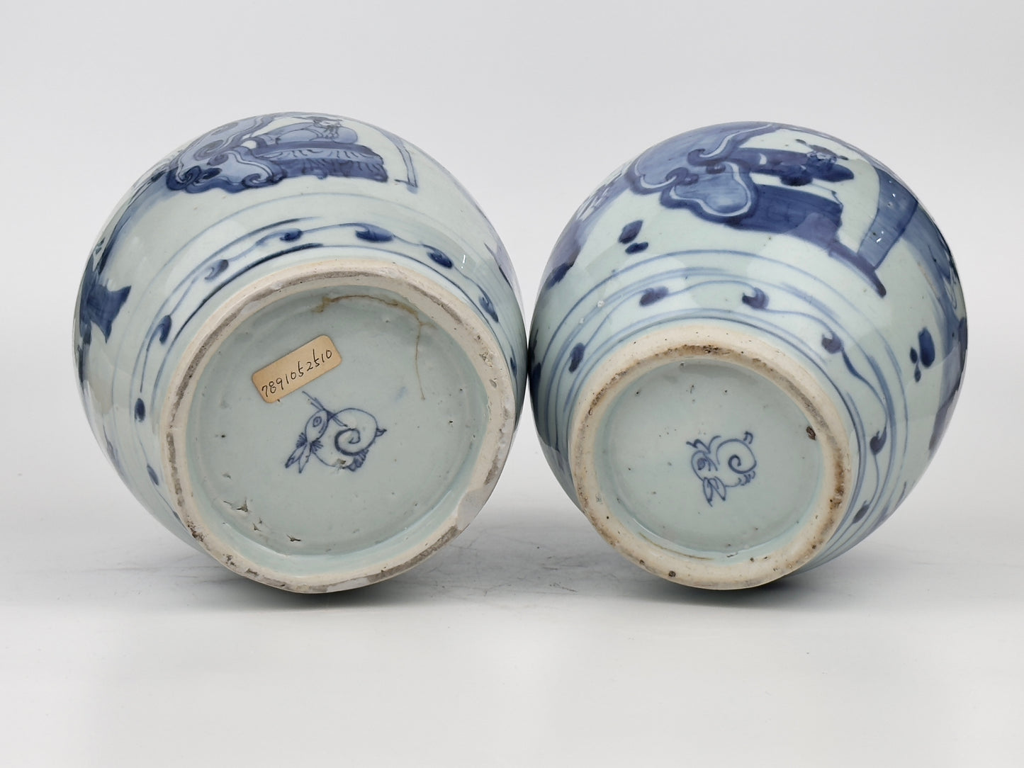 Two Chinese blue and white jars, painted with eight figures in a garden, marked on the bottom with a sitting rabbit(blue hare), Transitional period(Late Ming dynasty)