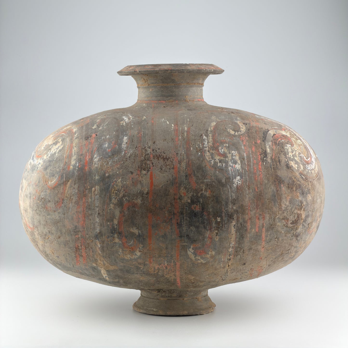 COCOON-SHAPED JAR WITH CLOUD-SCROLL DESIGN, HAN DYNASTY