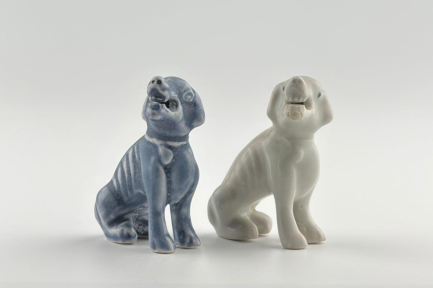Two Miniature White Figure of Seated Hounds, Circa 1725, Qing Dynasty, Yongzheng reign