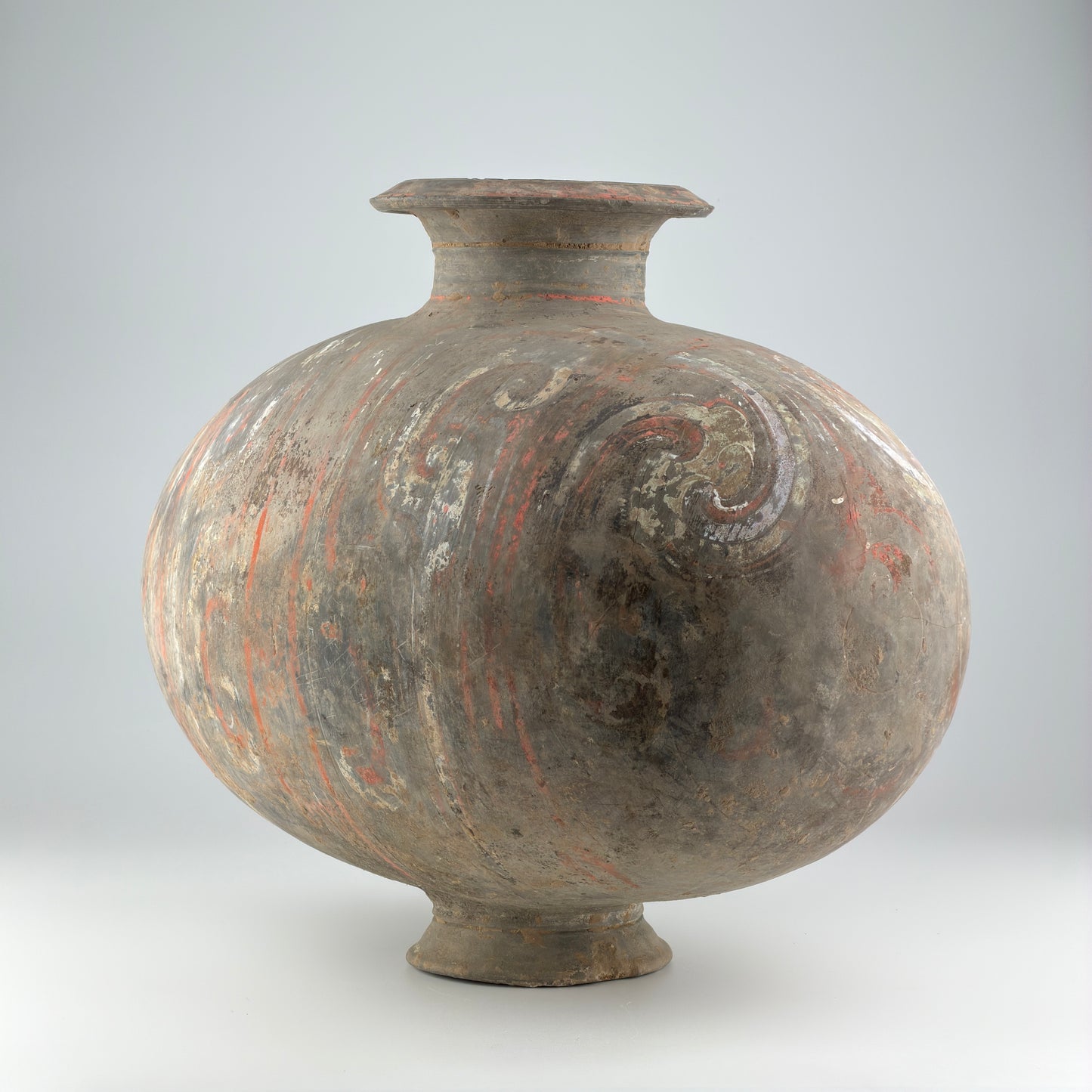 COCOON-SHAPED JAR WITH CLOUD-SCROLL DESIGN, HAN DYNASTY