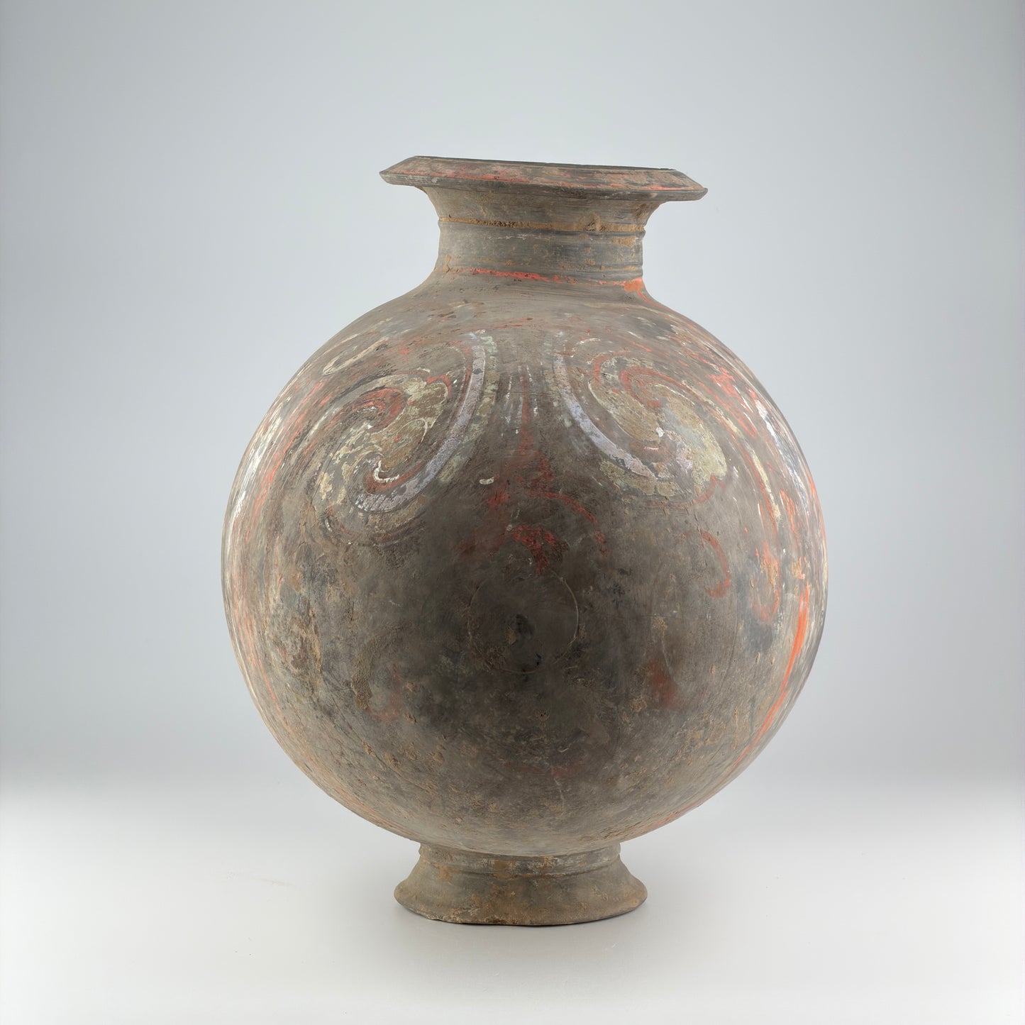 COCOON-SHAPED JAR WITH CLOUD-SCROLL DESIGN, HAN DYNASTY