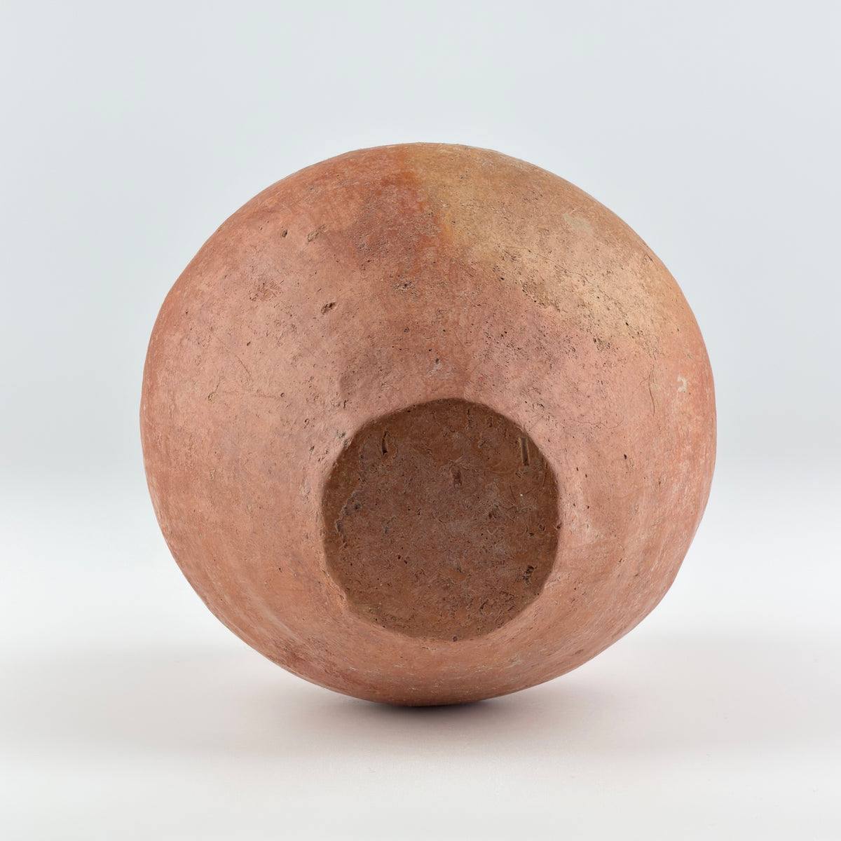 Neolithic Siwa Culture burnished pottery jar with reddish-brown body, ovoid form, and twin loop handles.