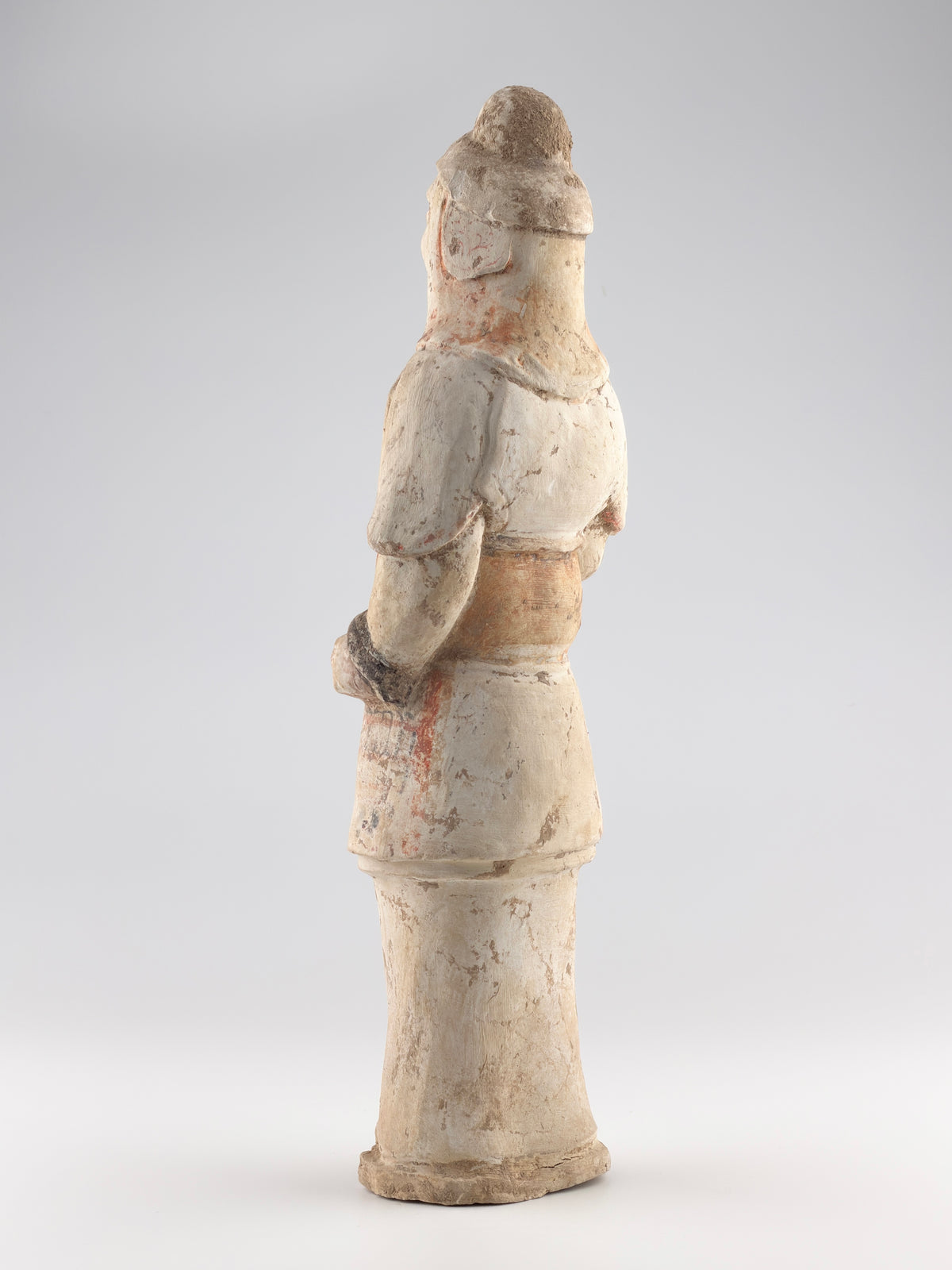 Sui-Tang Dynasty pottery warrior figure with raised arm, clenched fists, layered chest and shoulder armor, and original pigments.