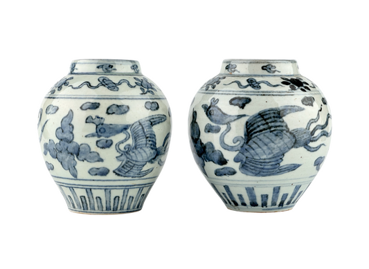 Ming Dynasty blue and white porcelain jar with phoenix among clouds and vertical lotus-petal motifs.