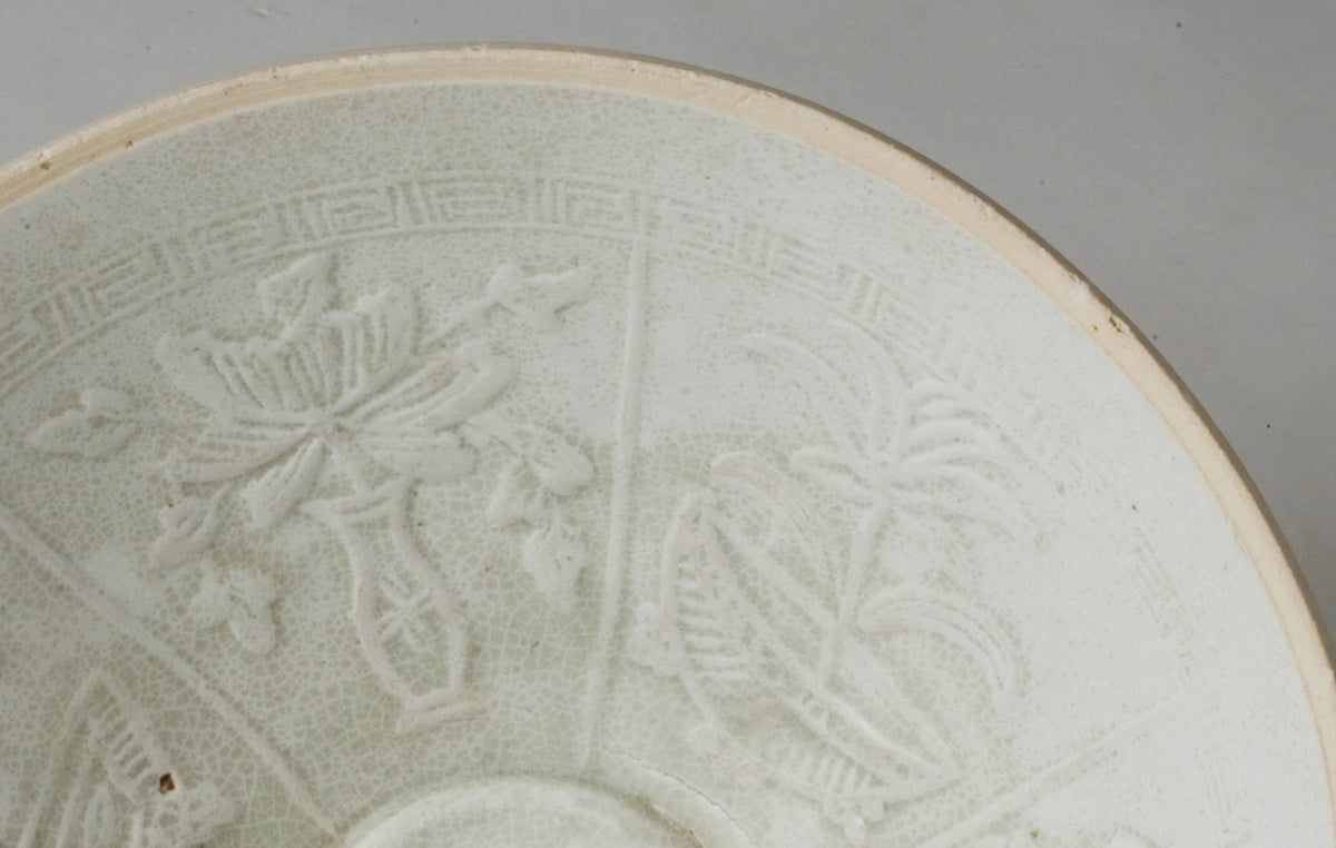 Song Dynasty Qingbai porcelain bowl with moulded hexagonal floral panels and pale bluish-white glaze with fine ice-crackle.