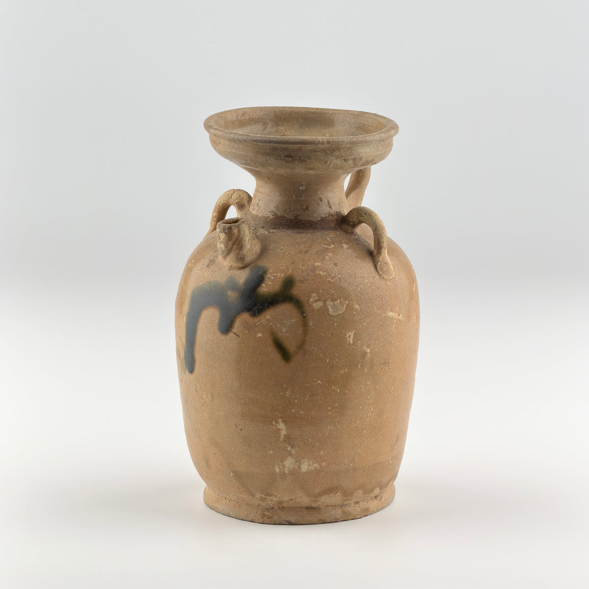 Tang Dynasty Changsha stoneware ewer with iron-brown splashes, loop handle, short spout, and pale buff glaze, 9th century Hunan.