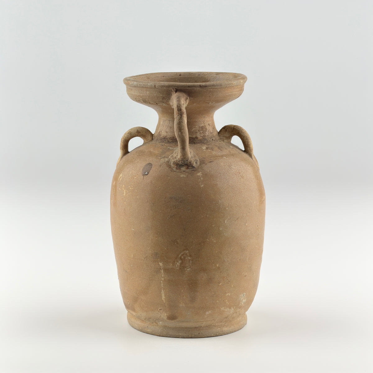 Tang Dynasty Changsha stoneware ewer with iron-brown splashes, loop handle, short spout, and pale buff glaze, 9th century Hunan.