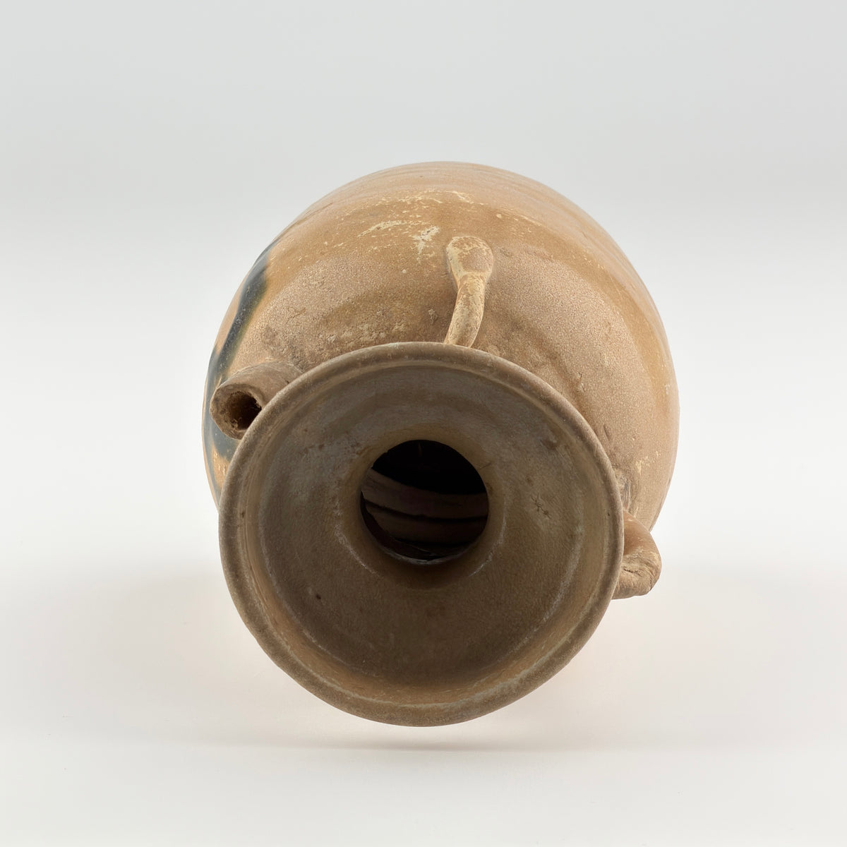 Tang Dynasty Changsha stoneware ewer with iron-brown splashes, loop handle, short spout, and pale buff glaze, 9th century Hunan.