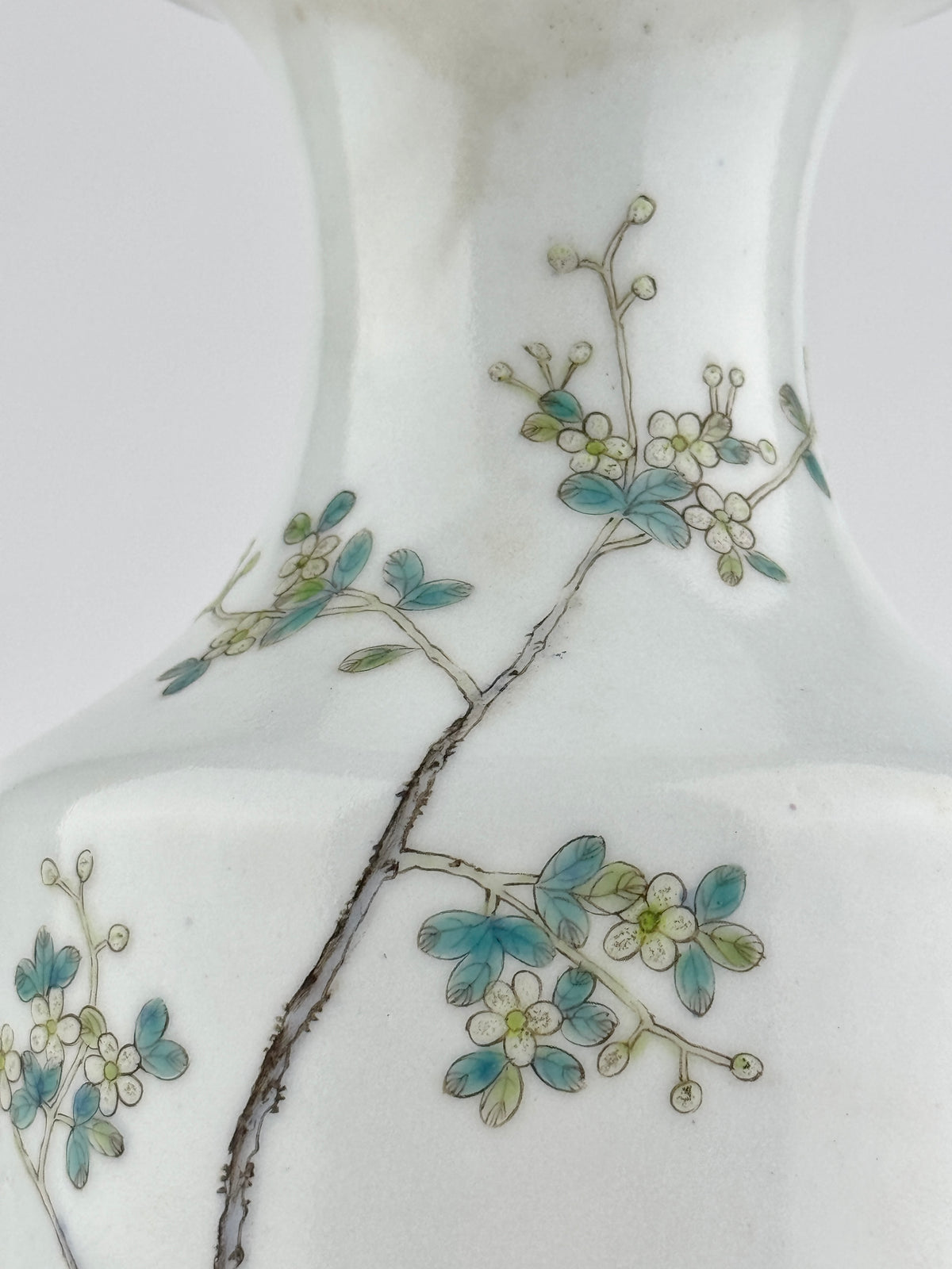 Famille rose porcelain vase, Late Qing-Republic period, with golden pheasant, peonies, butterflies, and iron-red beast-head handles.