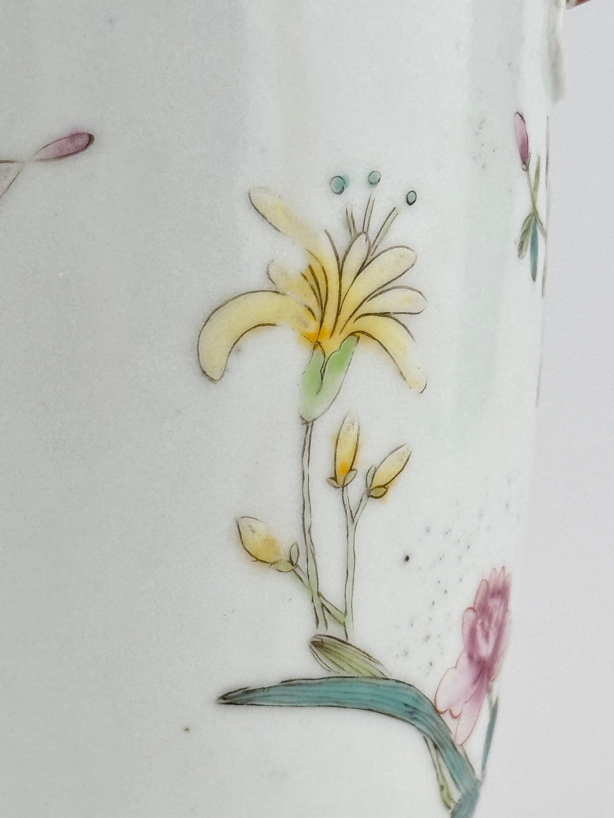 Famille rose porcelain vase, Late Qing-Republic period, with golden pheasant, peonies, butterflies, and iron-red beast-head handles.