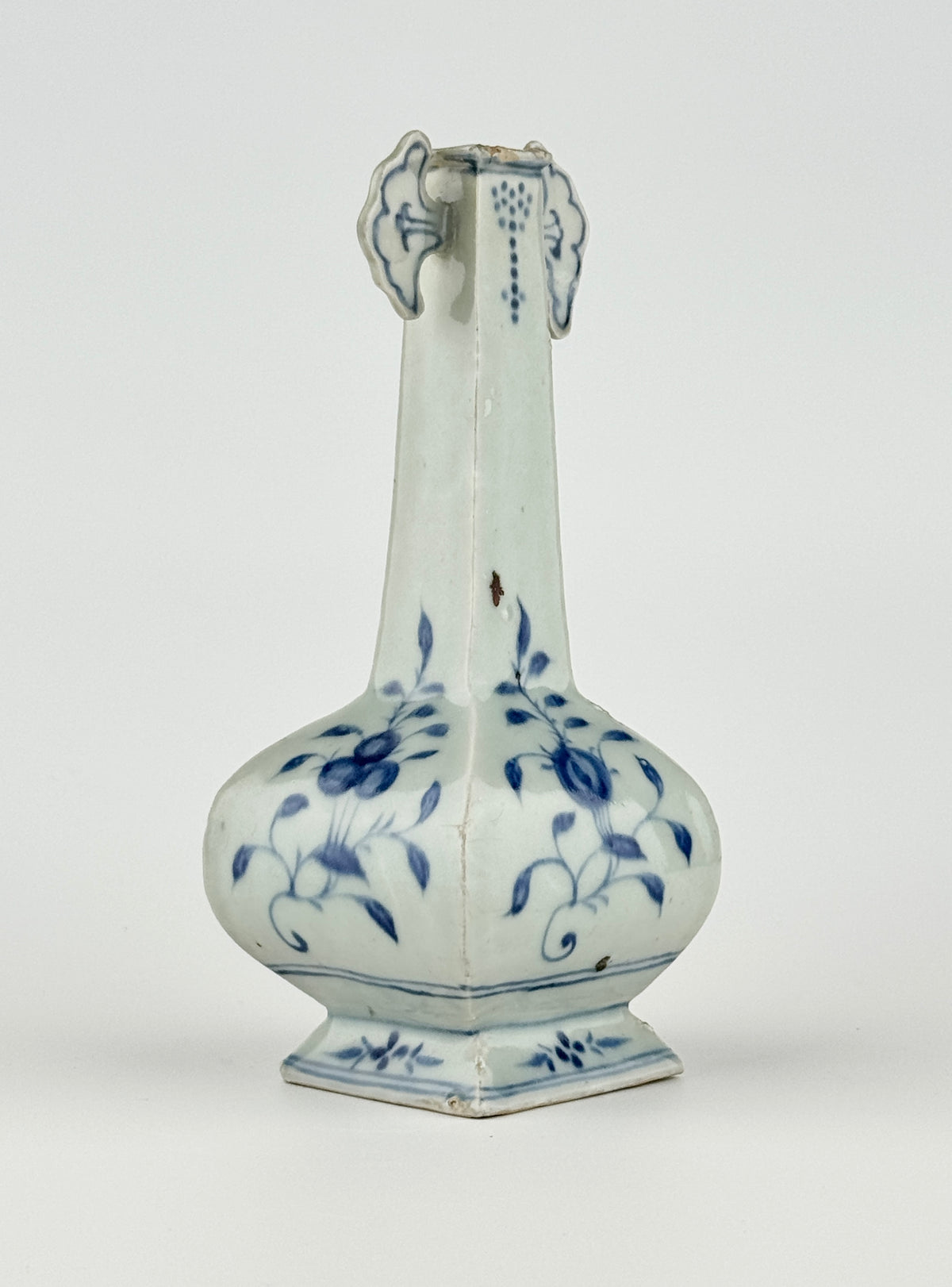 Ming-Qing blue and white porcelain four-sided vase with underglaze-blue floral scrolls and a softly glazed surface.