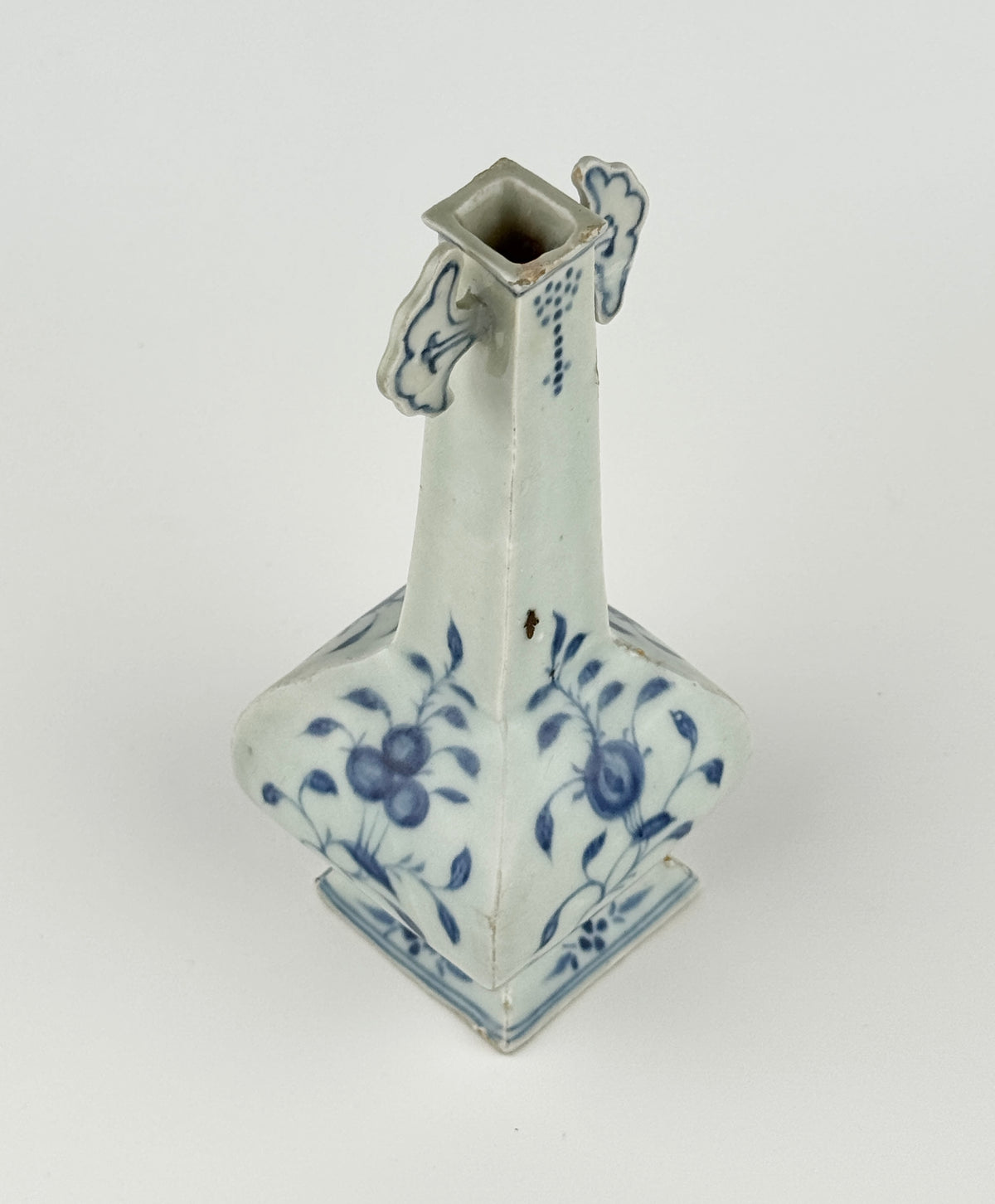 Ming-Qing blue and white porcelain four-sided vase with underglaze-blue floral scrolls and a softly glazed surface.