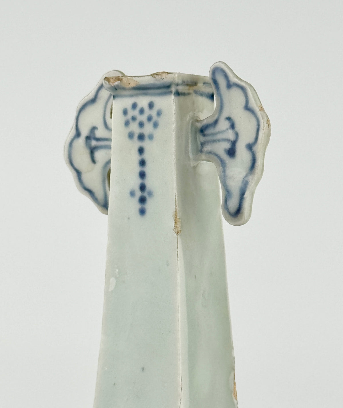Ming-Qing blue and white porcelain four-sided vase with underglaze-blue floral scrolls and a softly glazed surface.