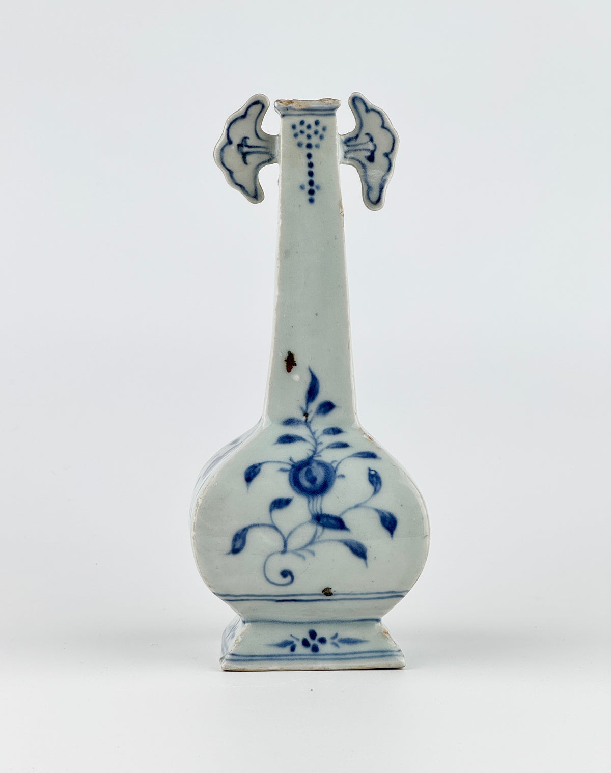 Ming-Qing blue and white porcelain four-sided vase with underglaze-blue floral scrolls and a softly glazed surface.