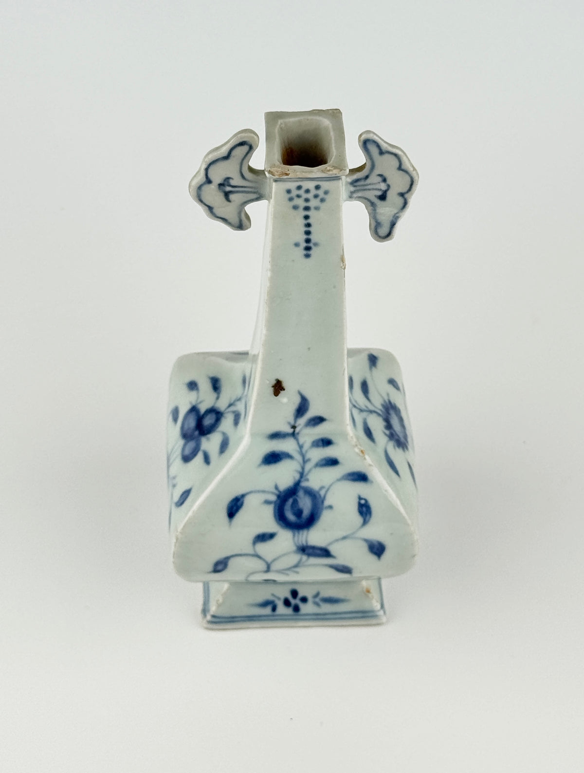 Ming-Qing blue and white porcelain four-sided vase with underglaze-blue floral scrolls and a softly glazed surface.
