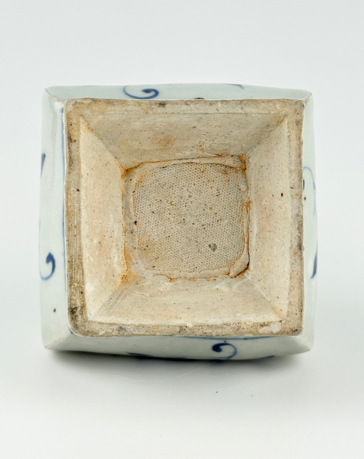 Ming-Qing blue and white porcelain four-sided vase with underglaze-blue floral scrolls and a softly glazed surface.
