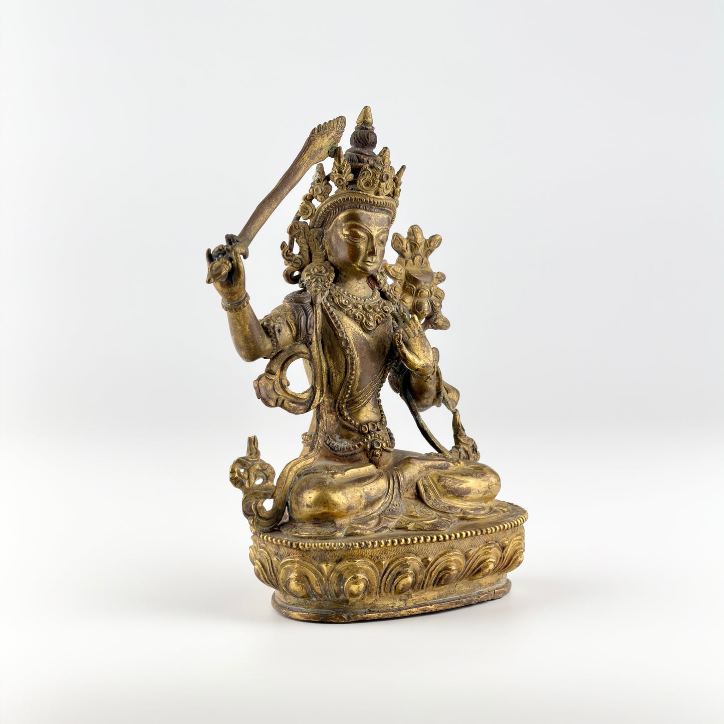 Gilt Bronze Figure of Manjusri Seated on a Lotus Base