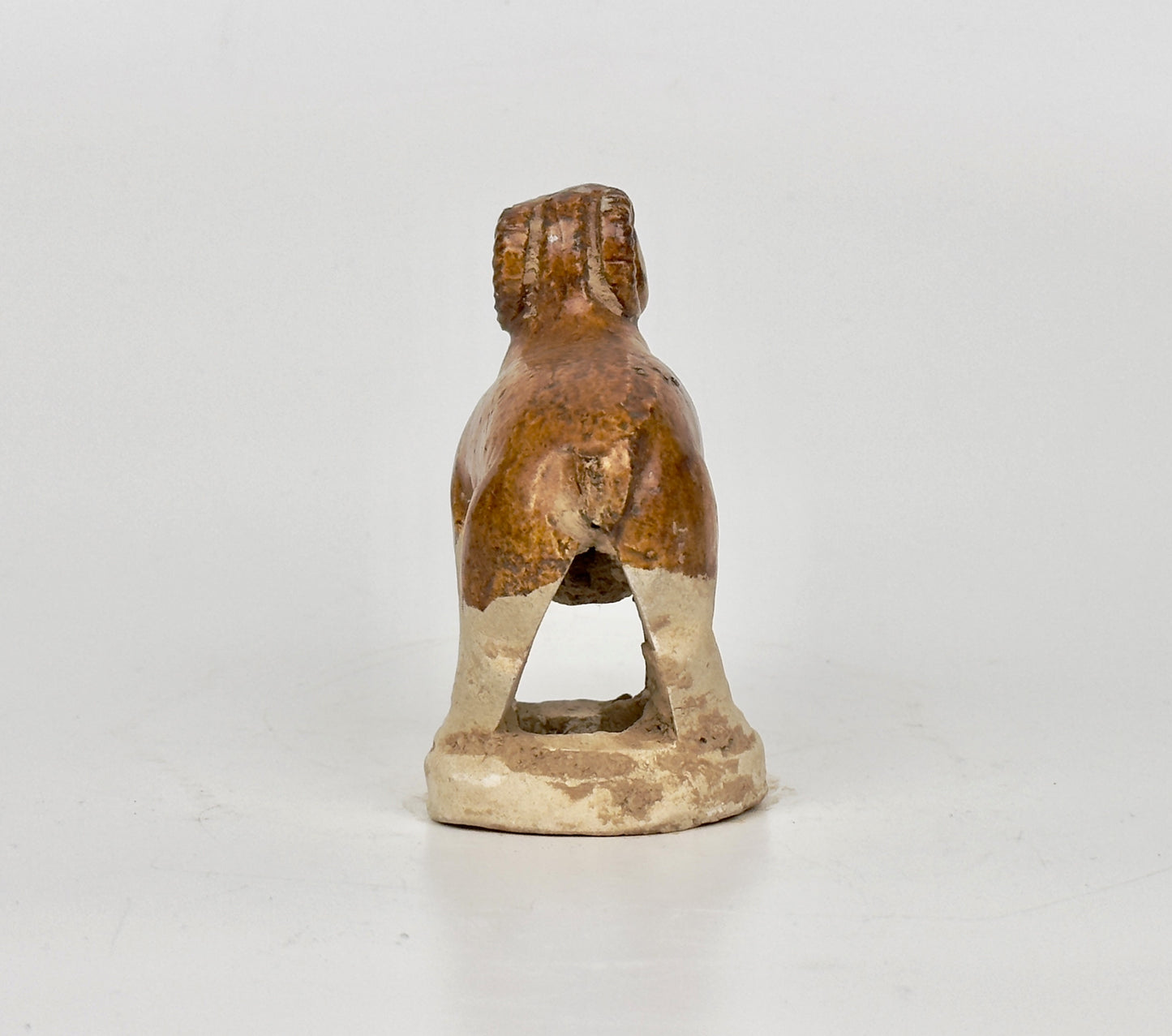 AMBER-GLAZED POTTERY FIGURE OF SHEEP, TANG-LIAO DYNASTY (7-12TH CENTURY)