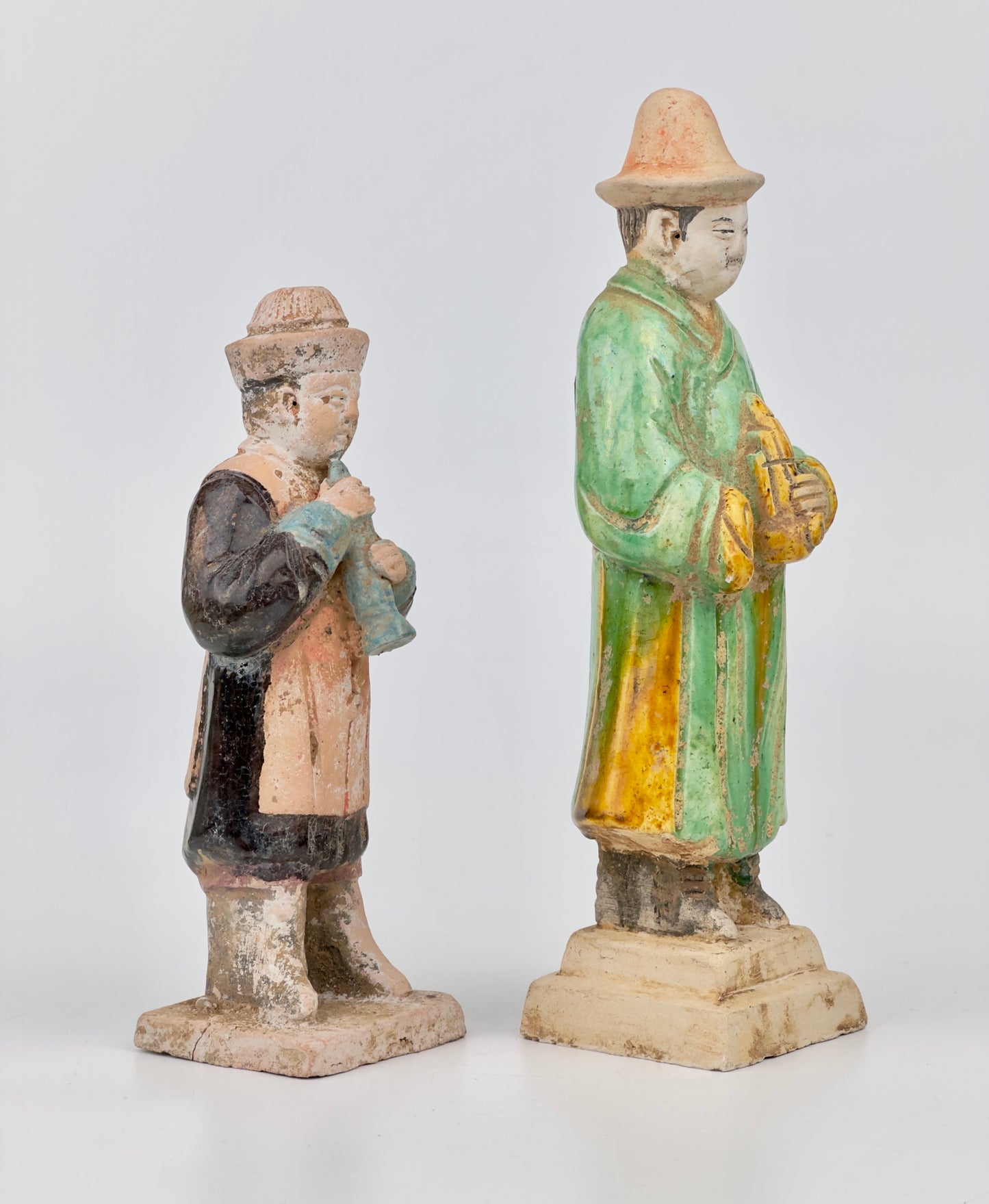 Two glazed figures playing the instrument, Ming Period (1368-1644)