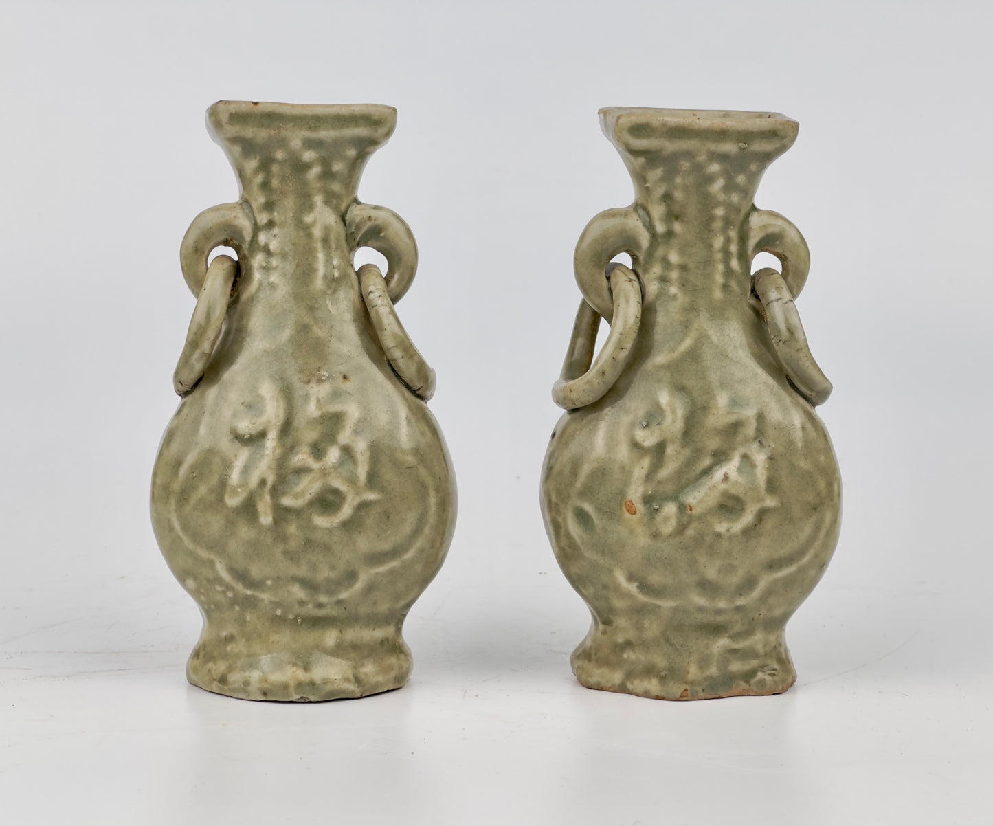 TWO MOLDED LONGQUAN CELADON 'FU SHOU' VASES, MING DYNASTY