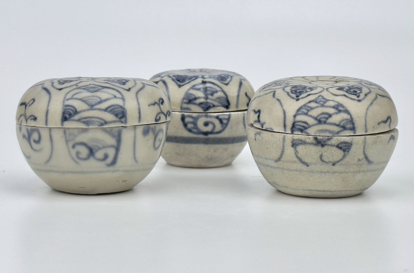 Three Annamese Small Lidded Boxes with flower design, 15th century, Le Dynasty