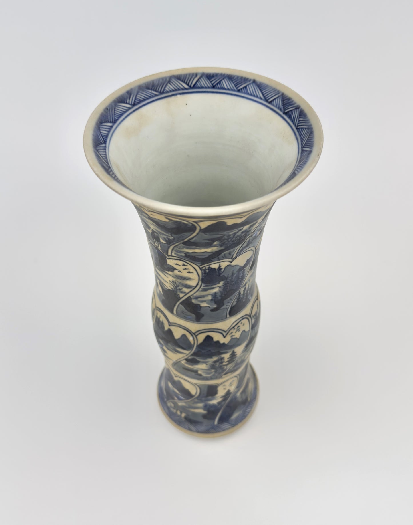 ANCIENT GU SHAPE BLUE AND WHITE 'RIVERSCAPES' VASE, QING DYNASTY, KANGXI ERA, CIRCA 1690