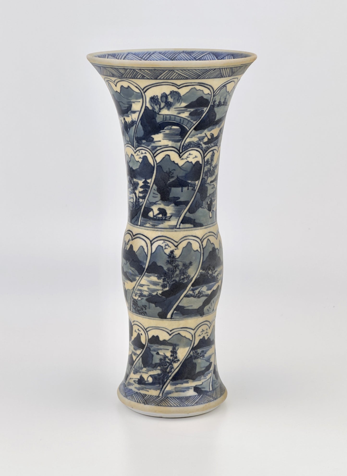 ANCIENT GU SHAPE BLUE AND WHITE 'RIVERSCAPES' VASE, QING DYNASTY, KANGXI ERA, CIRCA 1690