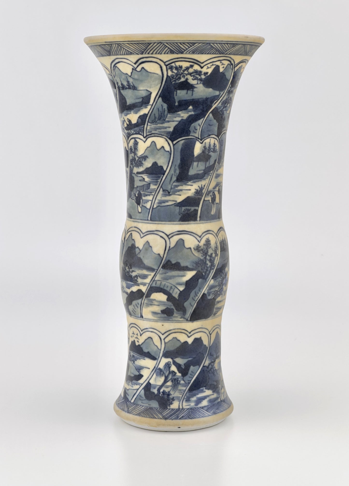 ANCIENT GU SHAPE BLUE AND WHITE 'RIVERSCAPES' VASE, QING DYNASTY, KANGXI ERA, CIRCA 1690