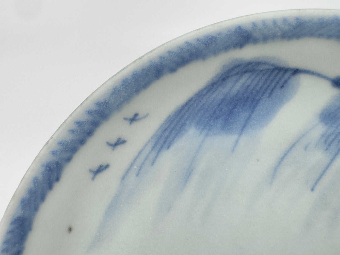 SCHOLARLY REPOSE BLUE AND WHITE SAUCER CIRCA 1725, QING DYNASTY, YONGZHENG REIGN