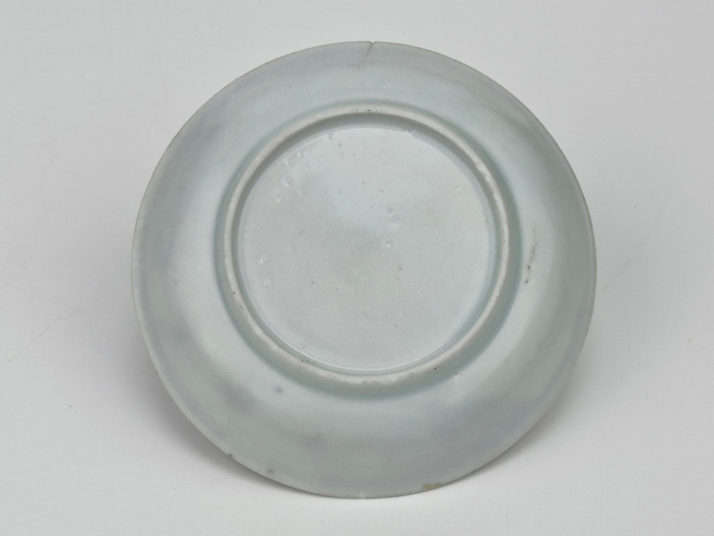 SCHOLARLY REPOSE BLUE AND WHITE SAUCER CIRCA 1725, QING DYNASTY, YONGZHENG REIGN