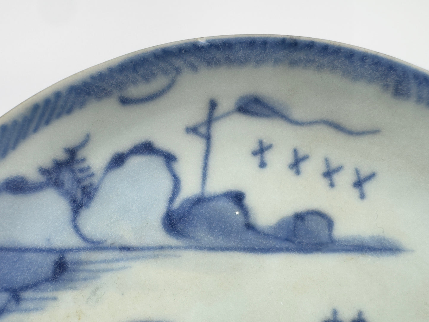 PASSING BOAT AND BRIDGE PATTERN BLUE AND WHITE TEABOWL AND SAUCER SET CIRCA 1725, QING DYNASTY, YONGZHENG ERA