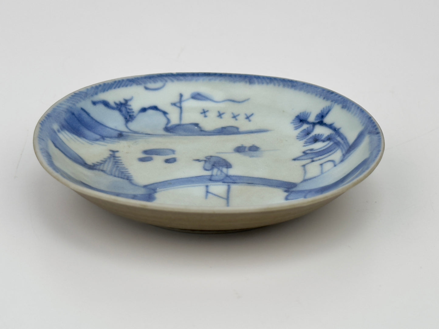 PASSING BOAT AND BRIDGE PATTERN BLUE AND WHITE TEABOWL AND SAUCER SET CIRCA 1725, QING DYNASTY, YONGZHENG ERA