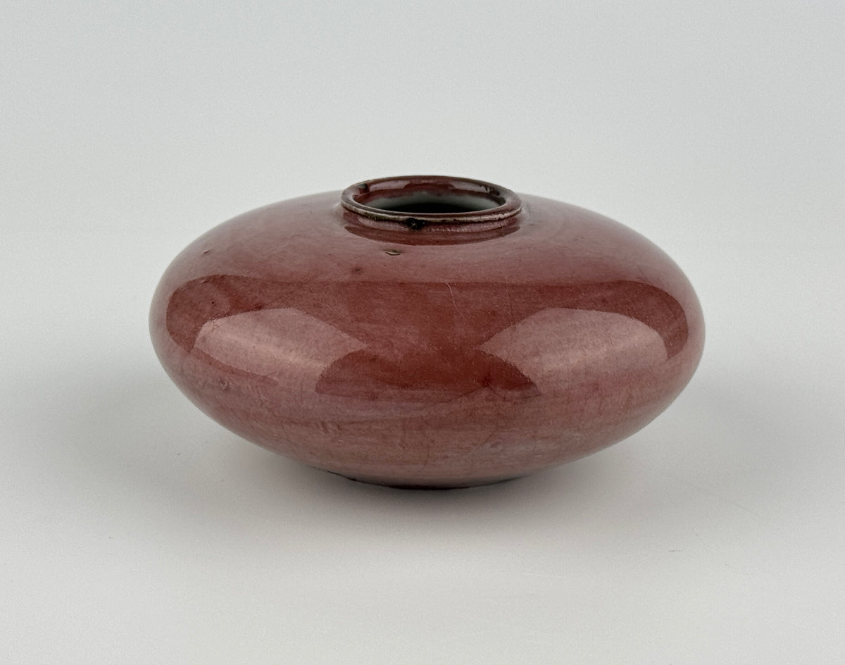 Qing Dynasty Langyao water coupe with rich crimson red copper glaze, rounded form, and lustrous finish, 18th–19th century.