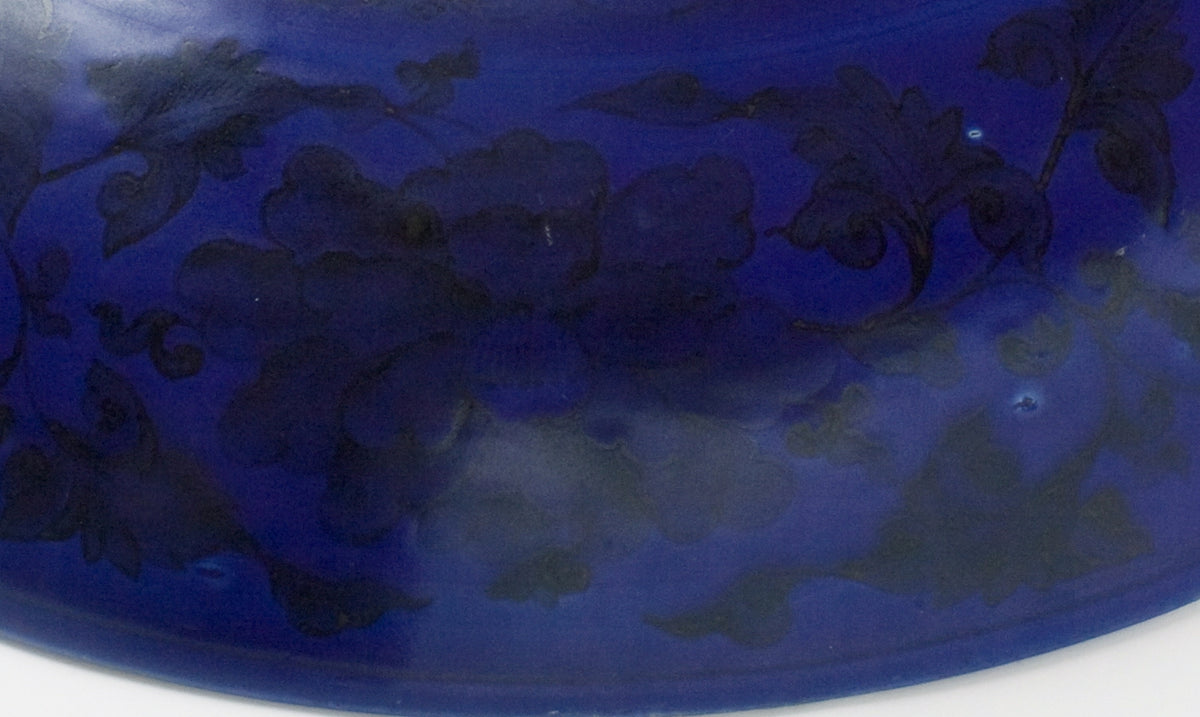 Large Qing Dynasty cobalt-blue glazed porcelain dish with rockwork and floral motifs, shipwreck-recovered, Kangxi-Yongzheng period.