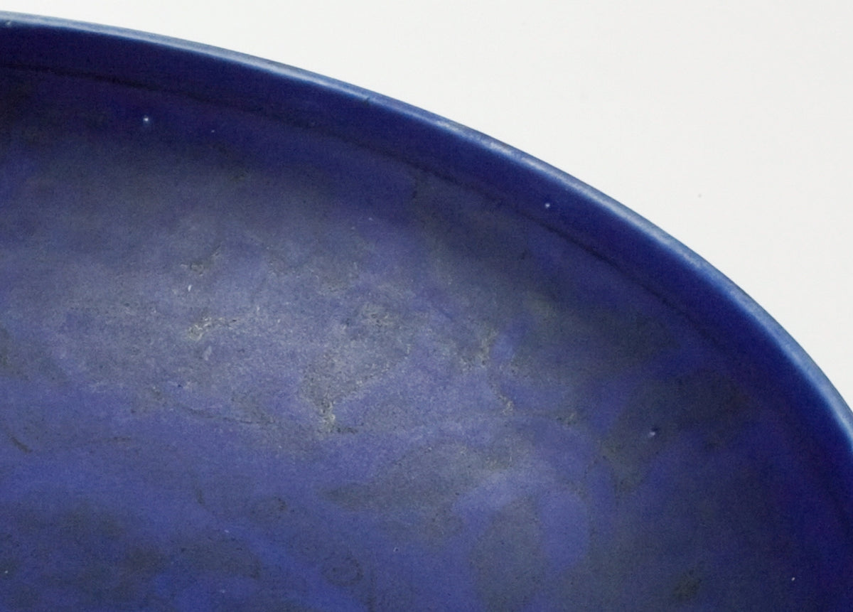 Large Qing Dynasty cobalt-blue glazed porcelain dish with rockwork and floral motifs, shipwreck-recovered, Kangxi-Yongzheng period.