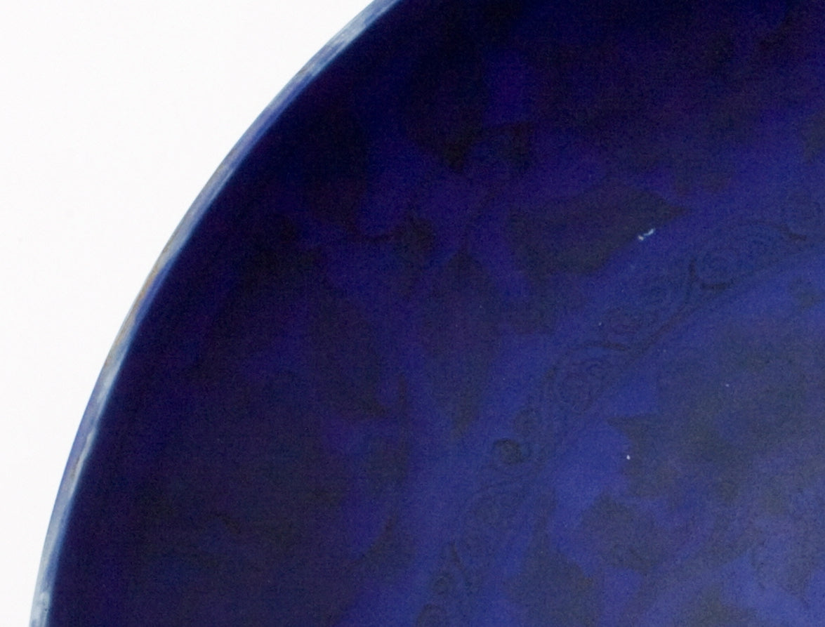 Large Qing Dynasty cobalt-blue glazed porcelain dish with rockwork and floral motifs, shipwreck-recovered, Kangxi-Yongzheng period.