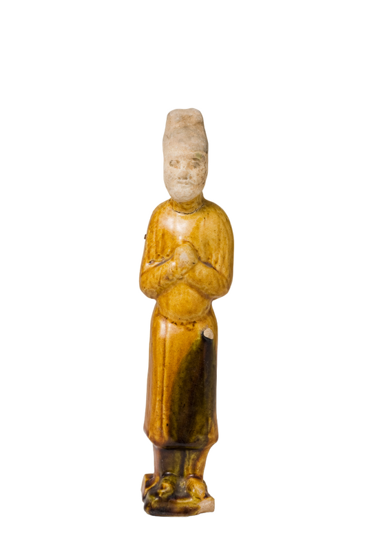 AMBER-GLAZED POTTERY FIGURE OF AN OFFICIAL, TANG-LIAO DYNASTY (7-12TH CENTURY)