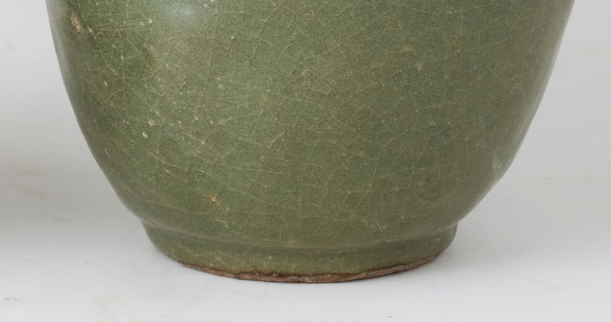 Pair of olive-green Longquan celadon vases with sculpted bird, mystical beasts, Sui-Song Dynasty.