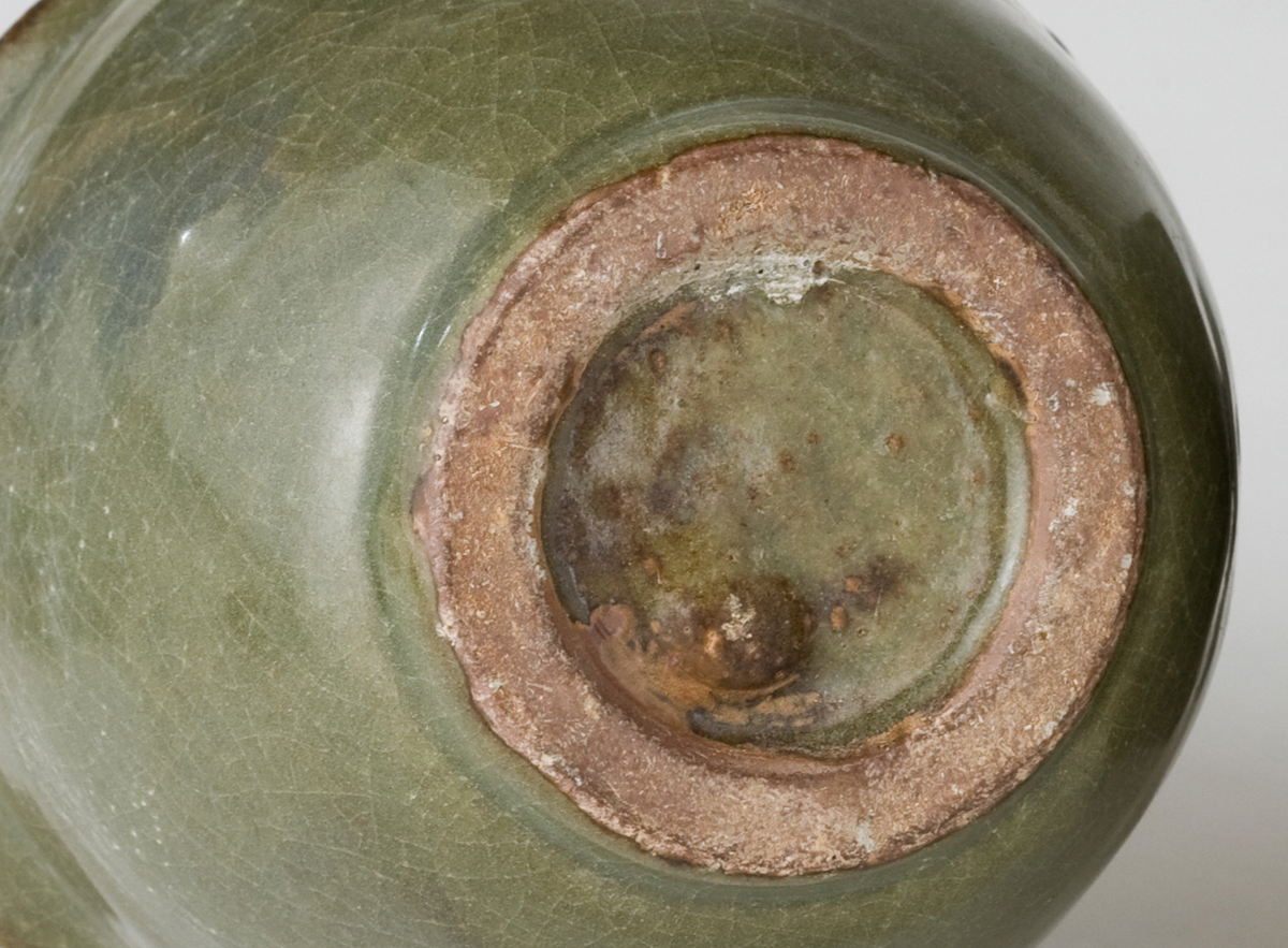 Pair of olive-green Longquan celadon vases with sculpted bird, mystical beasts, Sui-Song Dynasty.