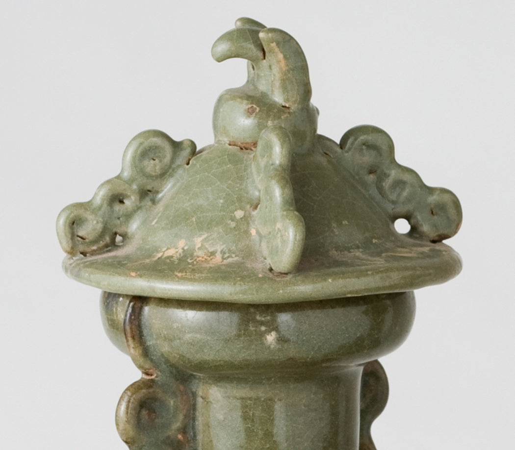 Pair of olive-green Longquan celadon vases with sculpted animal finials, crackled glaze, Sui-Song Dynasty.