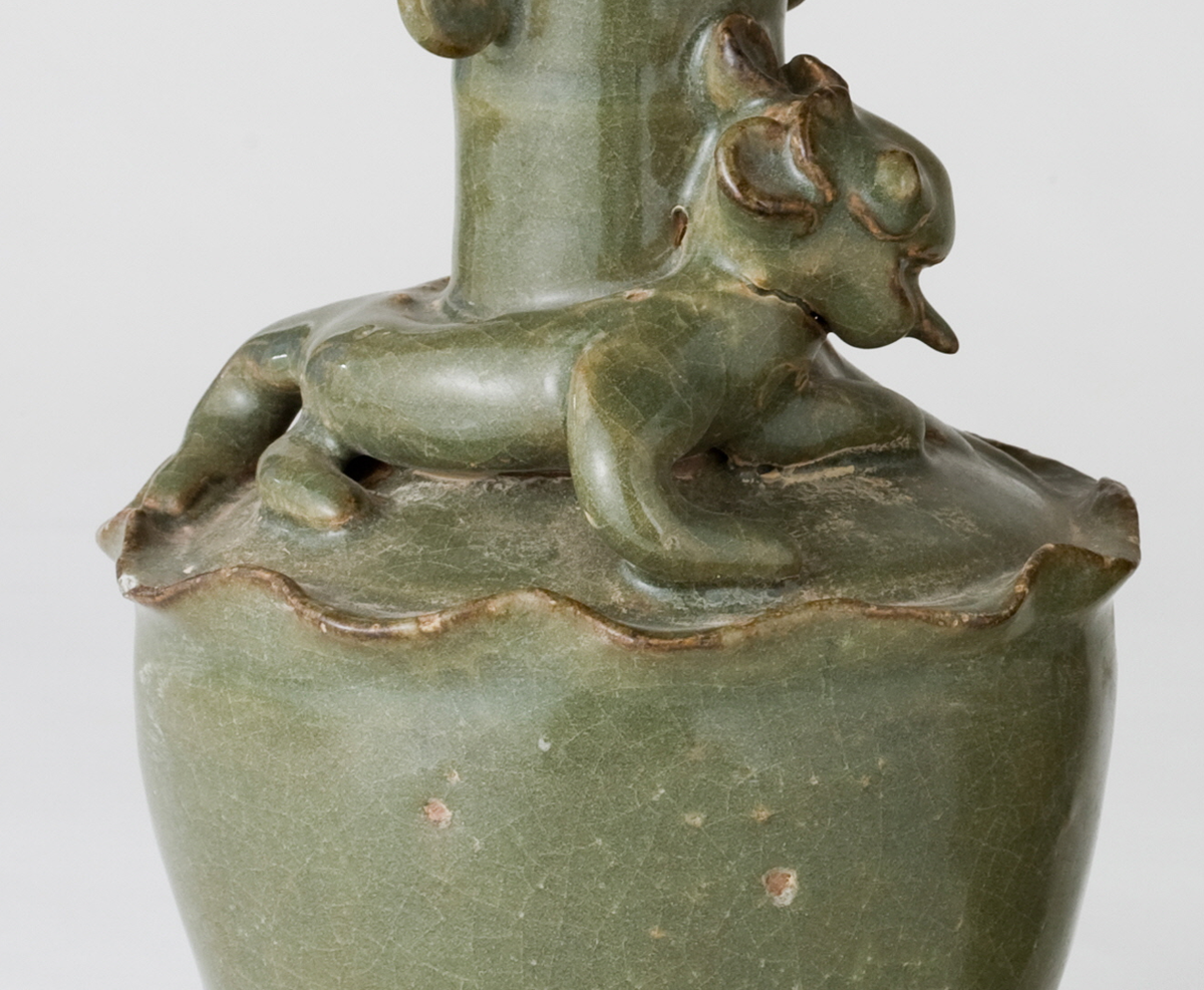 Pair of olive-green Longquan celadon vases with sculpted animal finials, crackled glaze, Sui-Song Dynasty.