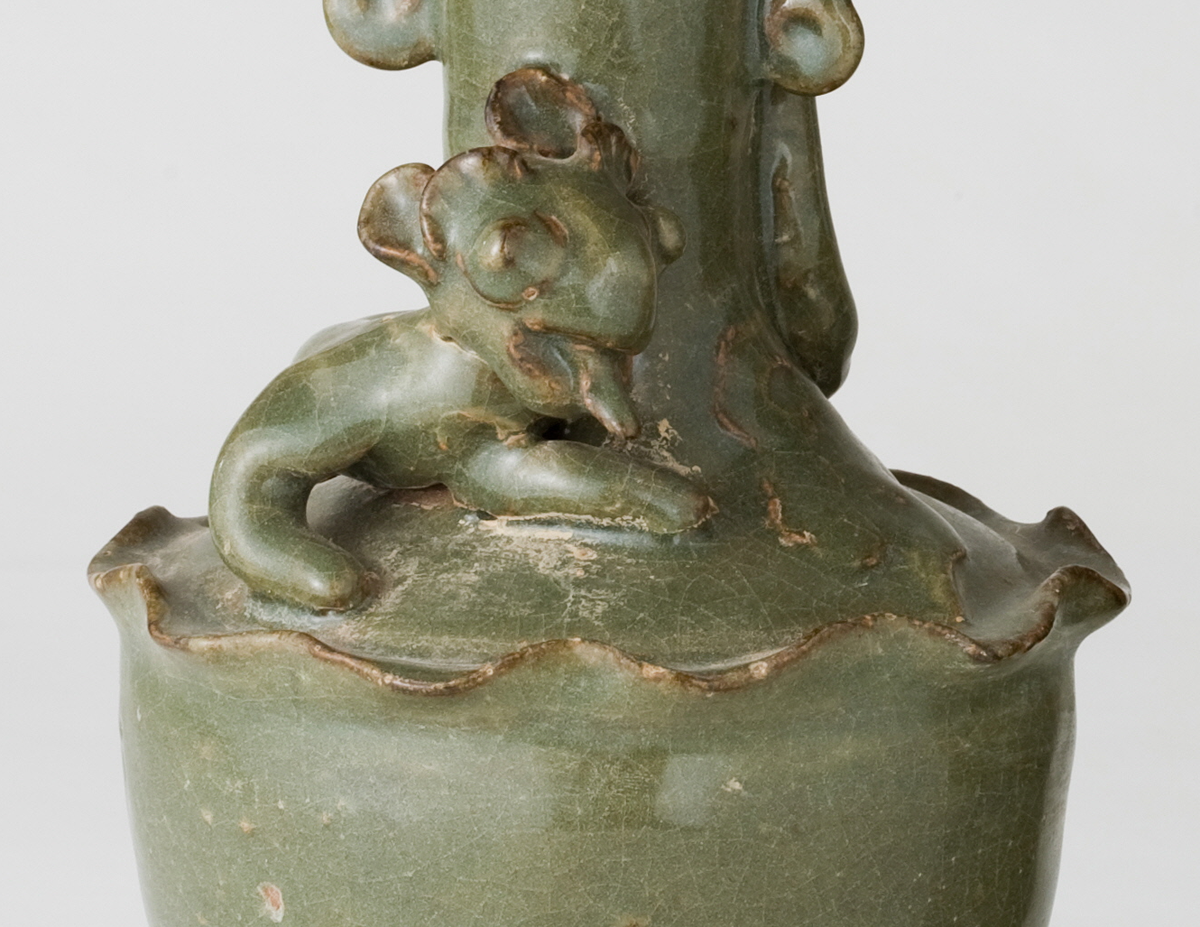 Pair of olive-green Longquan celadon vases with sculpted animal finials, crackled glaze, Sui-Song Dynasty.