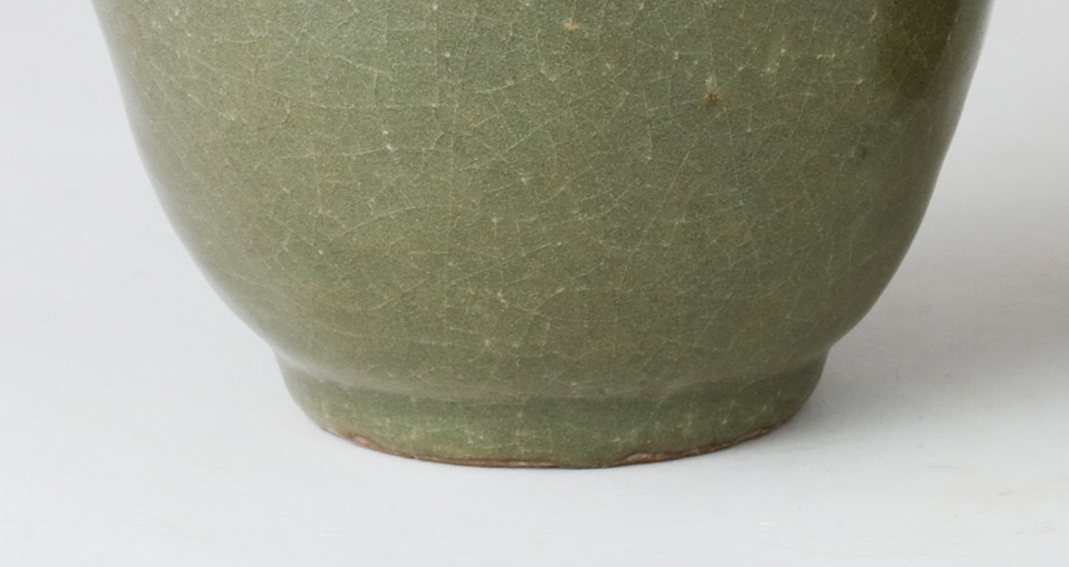 Pair of olive-green Longquan celadon vases with sculpted bird, mystical beasts, Sui-Song Dynasty.