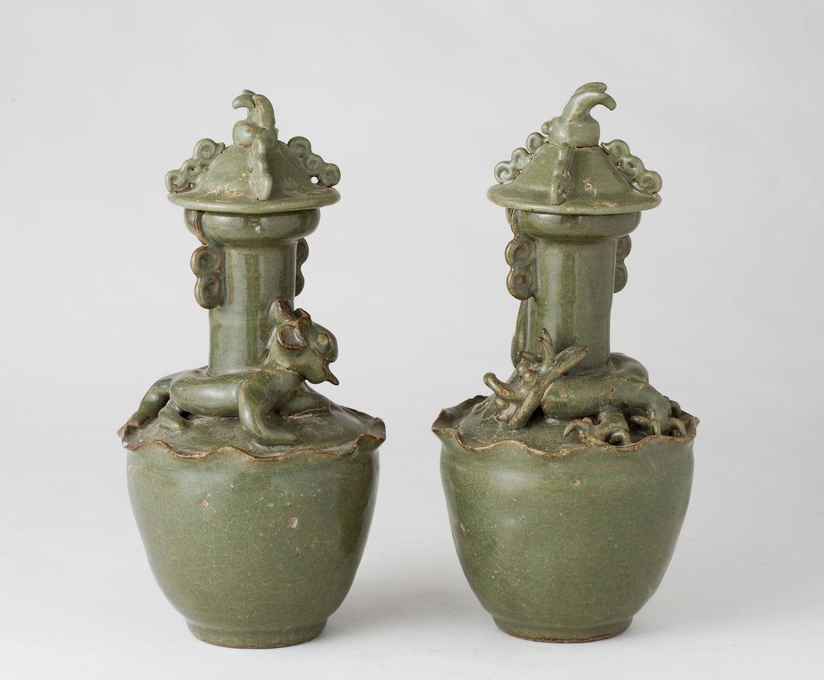 Pair of olive-green Longquan celadon vases with sculpted bird, mystical beasts, Sui-Song Dynasty.
