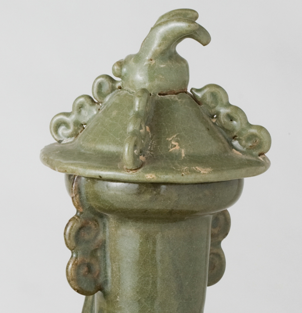 Pair of olive-green Longquan celadon vases with sculpted bird, mystical beasts, Sui-Song Dynasty.