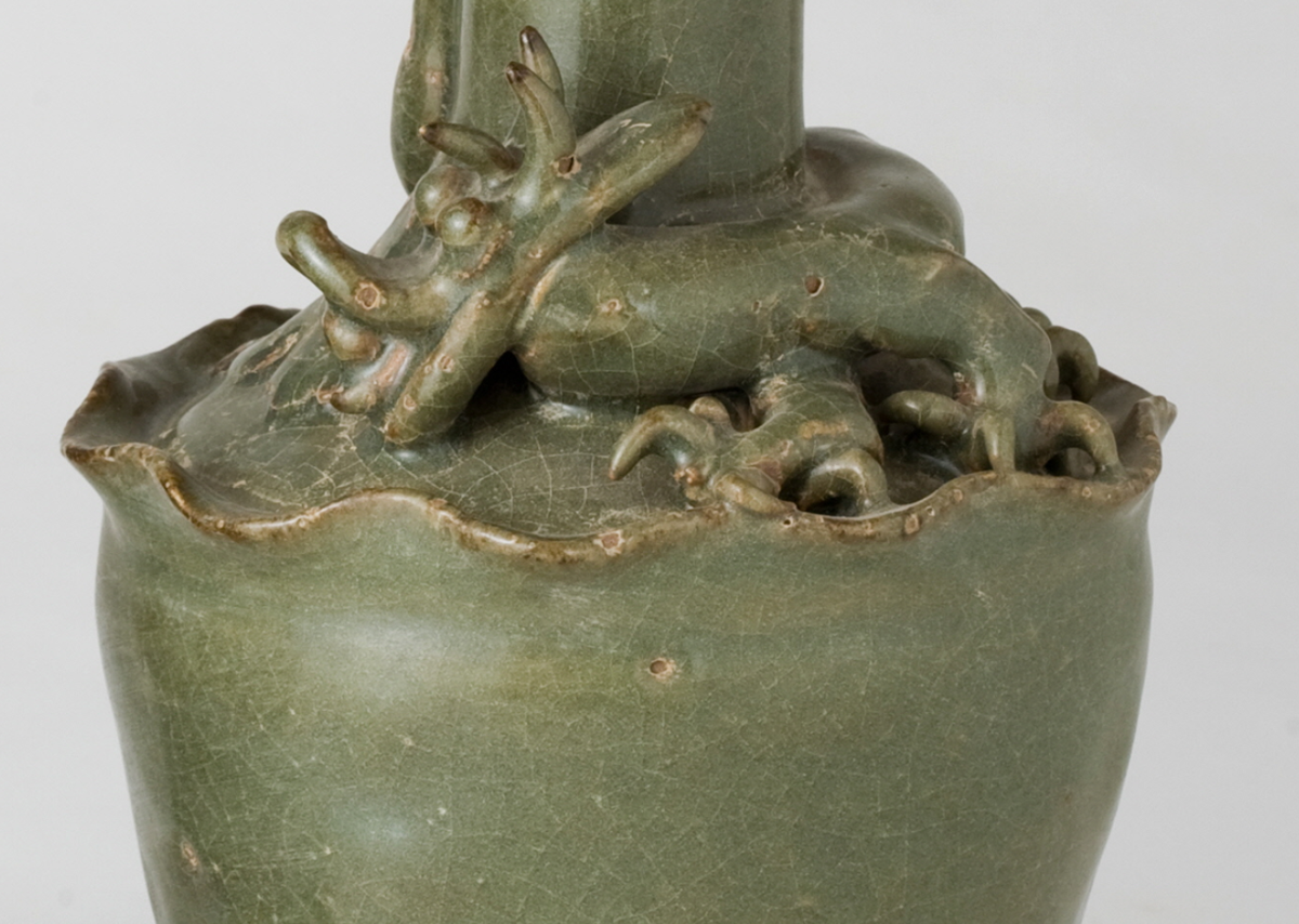 Pair of olive-green Longquan celadon vases with sculpted bird, mystical beasts, Sui-Song Dynasty.