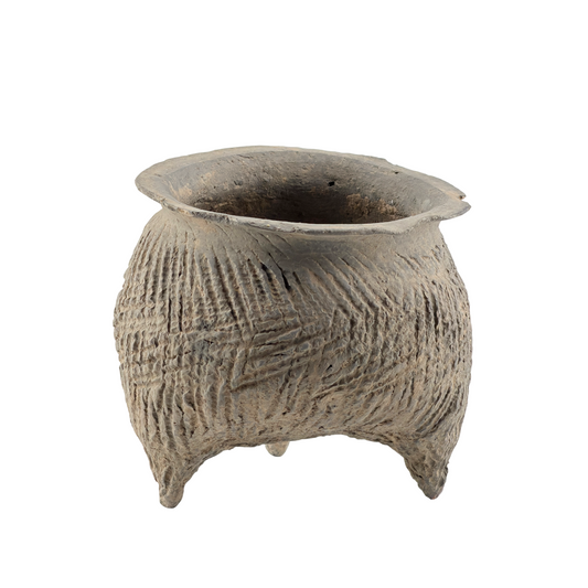 Shang-Zhou Dynasty grey pottery tripod li vessel with impressed geometric patterns, short legs, and a wide open mouth.