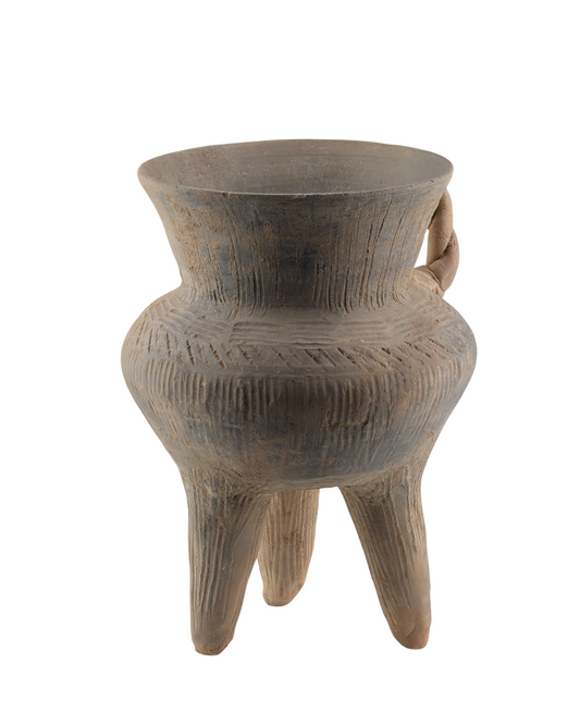 Neolithic grey earthenware tripod vessel with sturdy triangular legs, incised diagonal patterns, wide mouth, and rare twisted handle.