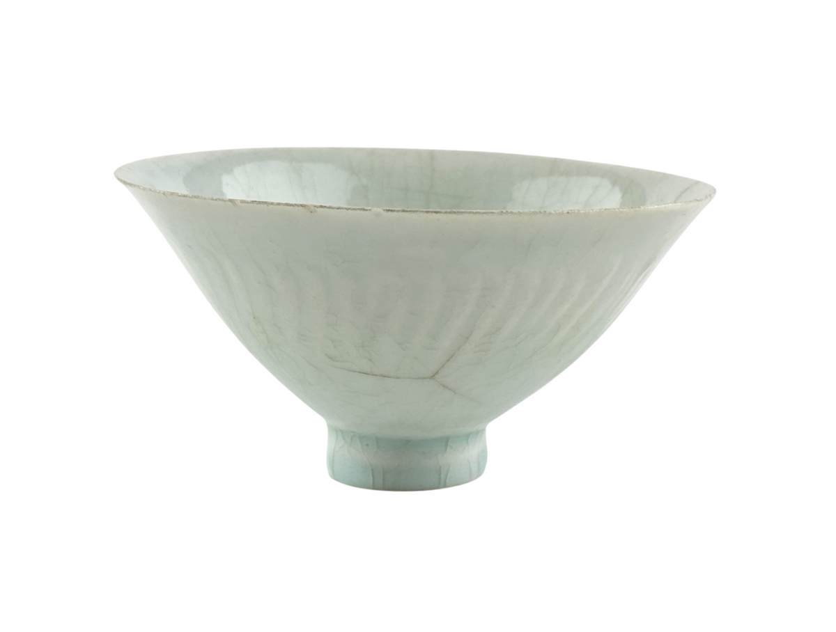 Southern Song-Yuan Qingbai porcelain conical bowl with pale bluish glaze, lotus-petal relief, and natural crackling.